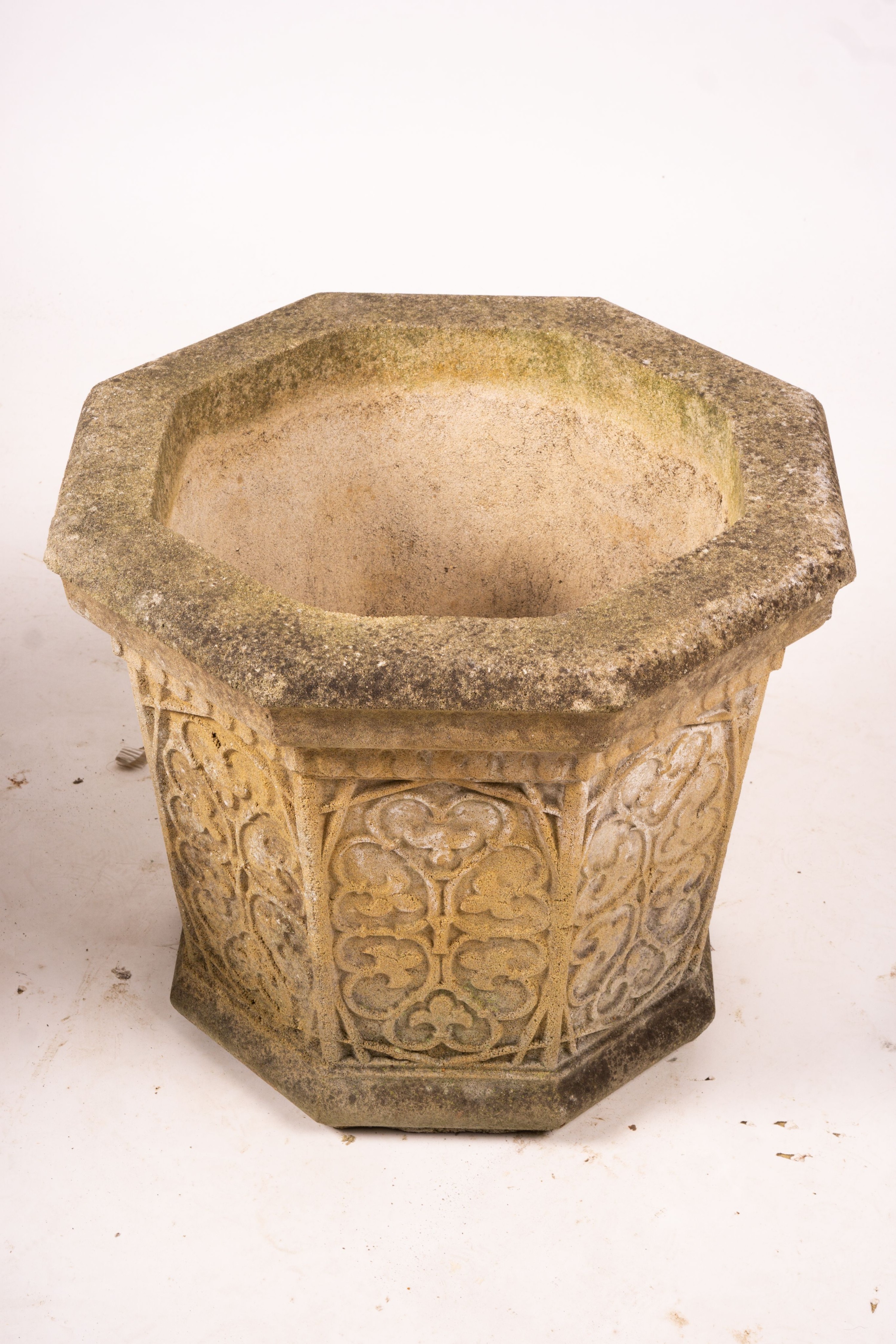 A pair of octagonal reconstituted stone garden planters, width 48cm, height 42cm